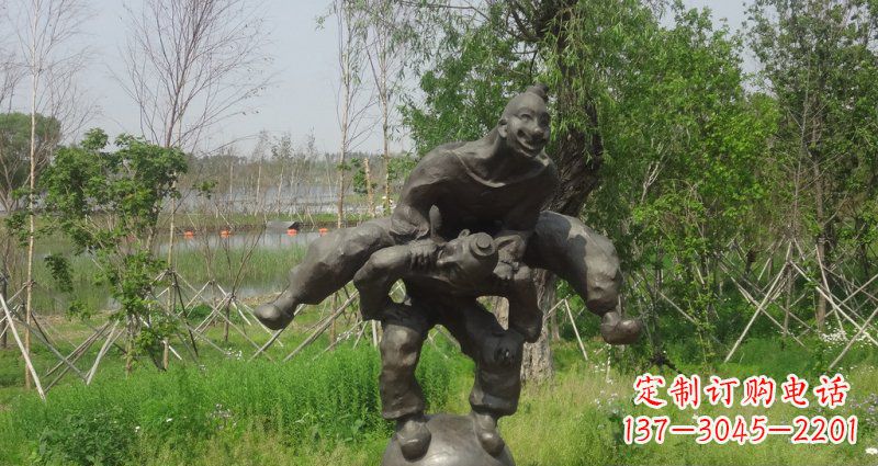 烟台园林站在球上面跳山羊的人物景观铜雕